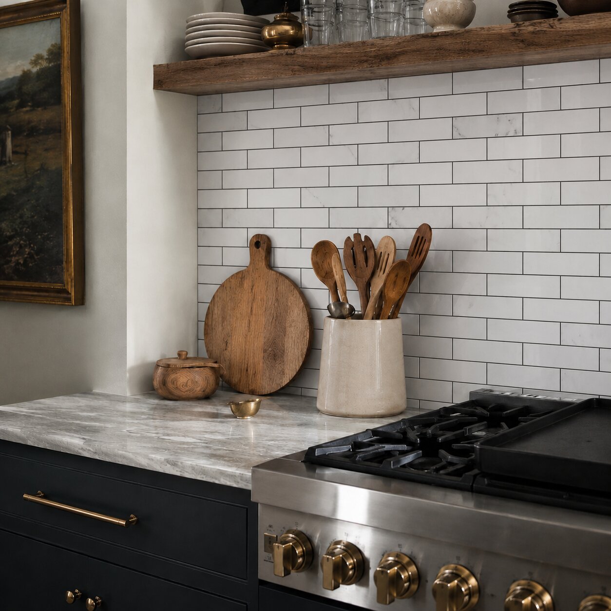 Modern transitional kitchen featuring a white polished marble mosaic subway tile backsplash with dark charcoal grout.
