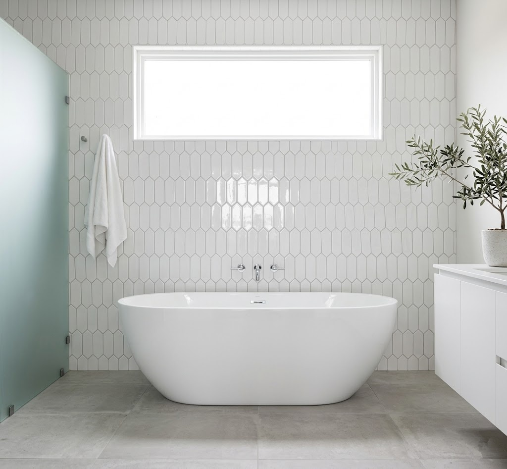Modern bathroom featuring glossy white picket ceramic tiles in a vertical arrangement on the wall.