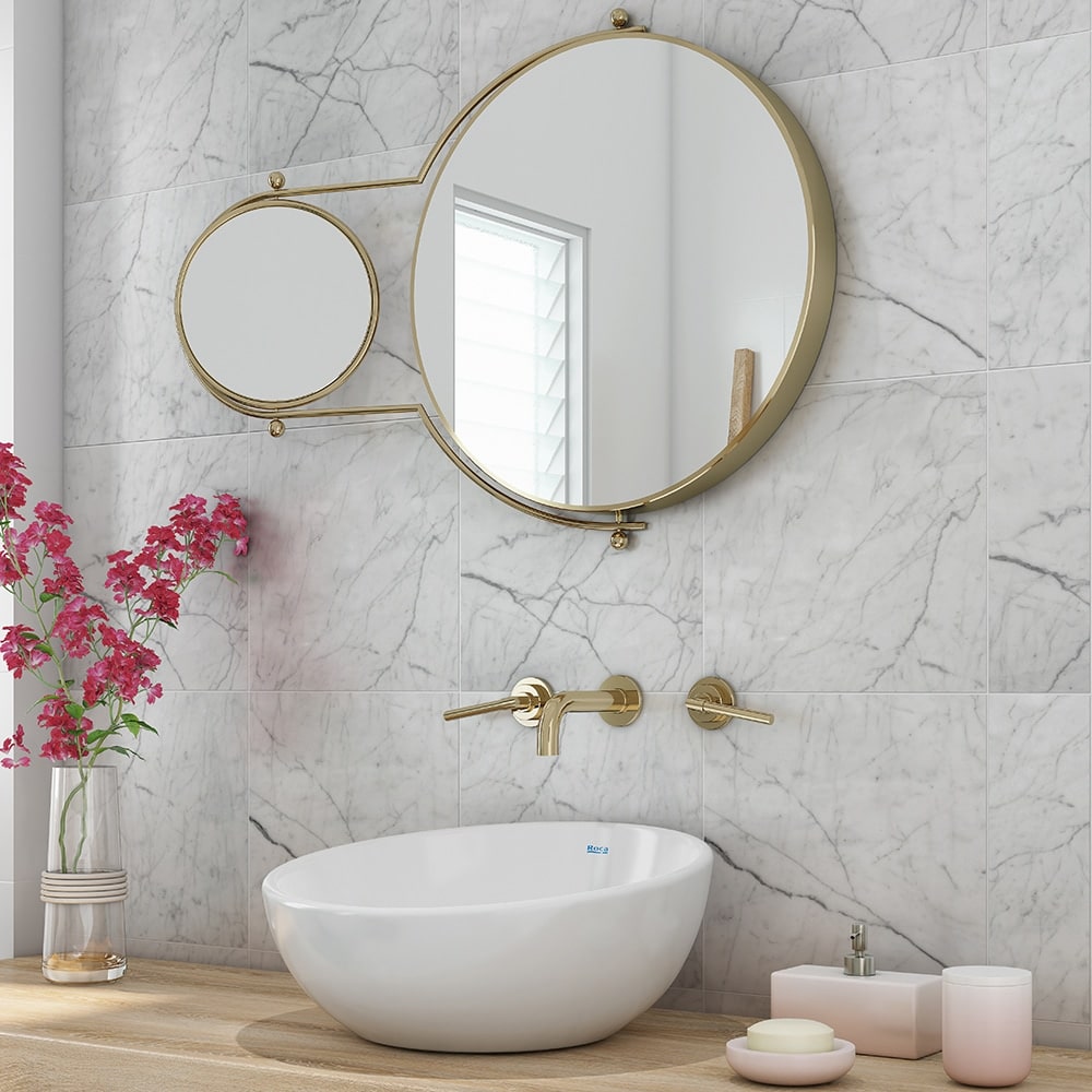 Modern bathroom featuring white marble wall tiles.
